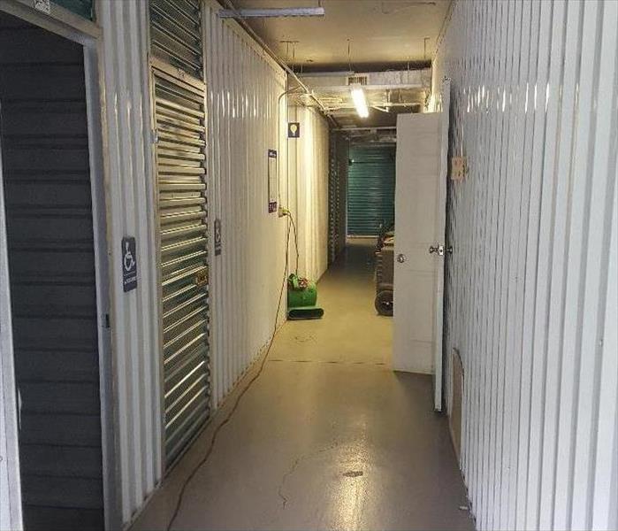 Clean and dry hallway in storage facility with SERVPRO machines.