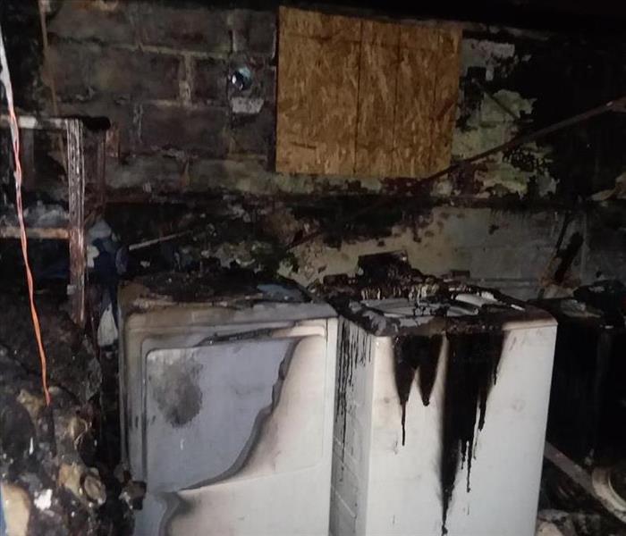 Washer and Dryer in basement damaged by fire. 